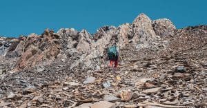 Taking The High Road During Divorce. Man trying to climb steep mountain